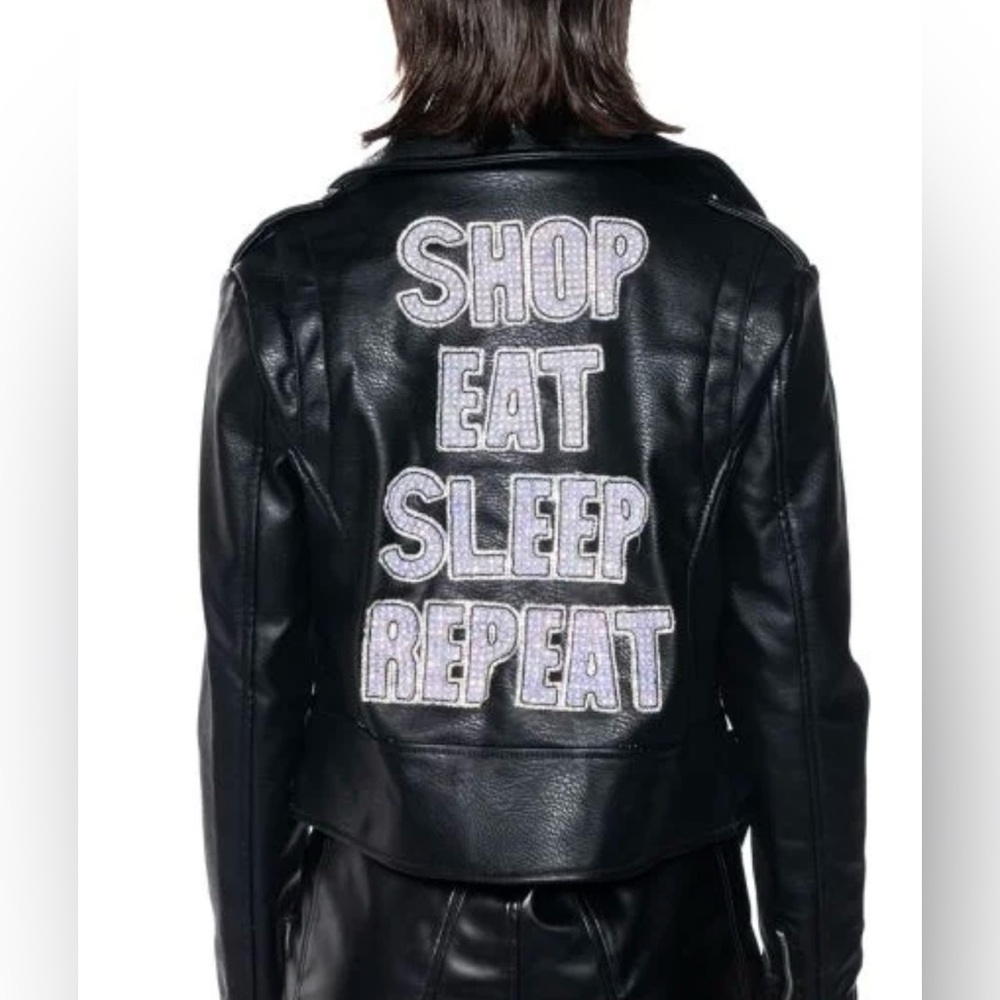 SHOP EAT SLEEP
REPEAT EMBELLISHED FAUX LEATHER MOTO
JACKET IN BLACK
MULTI